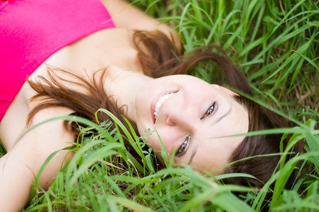 Smiling woman wearing partial dentures